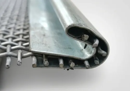 Detailed macro shot of a hooked edge and metal binder structure on a crimped wire mesh panel