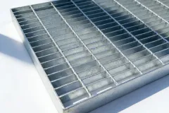 Steel grating drainage trench cover installed in outdoor walkway